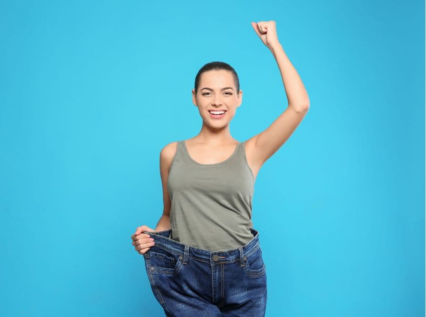 A woman with her hand up in the air