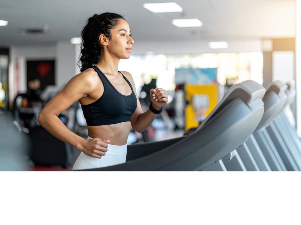 Women on treadmill exercising