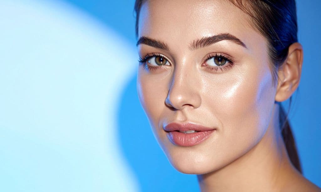 A woman with clear skin looking at the camera