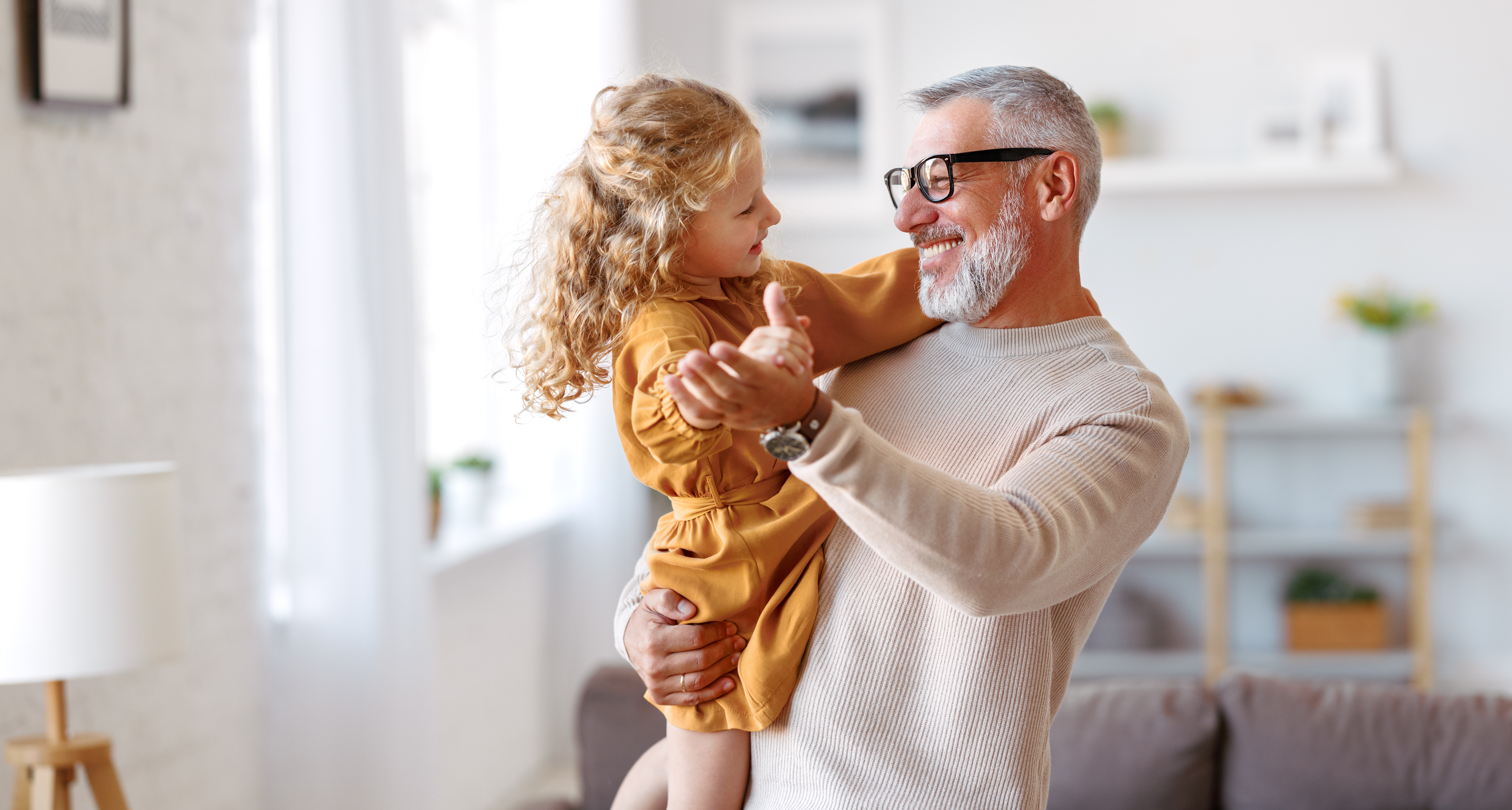 a loving grandfather with his grand daughter